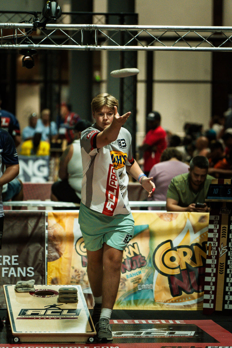 Brotherhood Cornhole athlete Hunter Thorson throwing during ACL Pro cornhole tournament match.